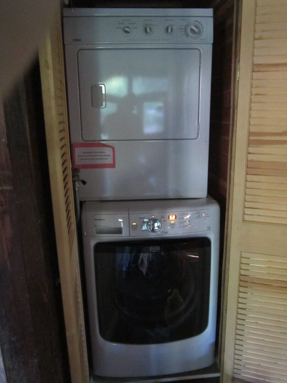 washer & drier in closet, between kitchen and bathroom