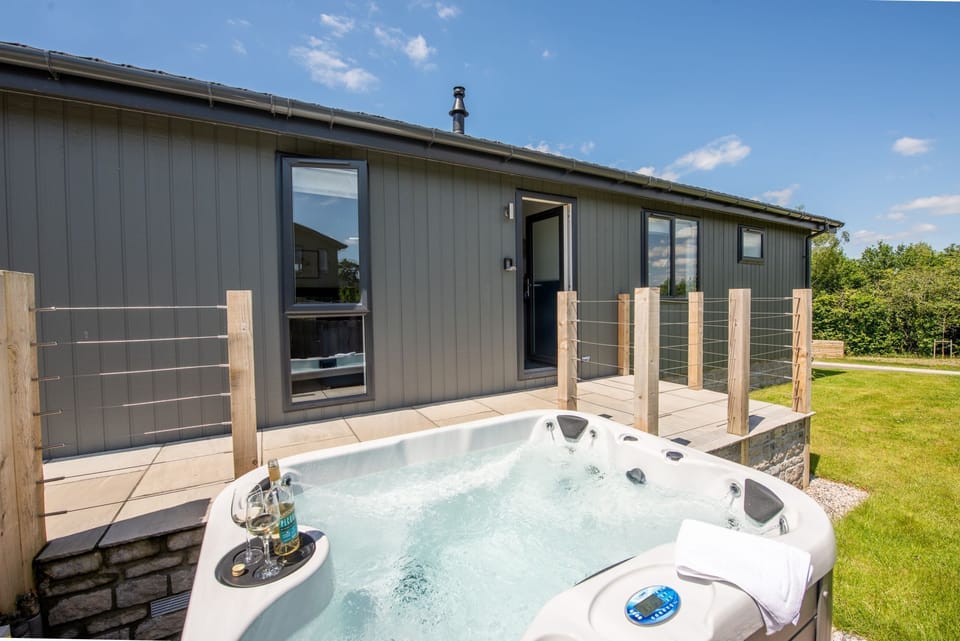 The hot tub outside the property and decking - Buttercup Lodge