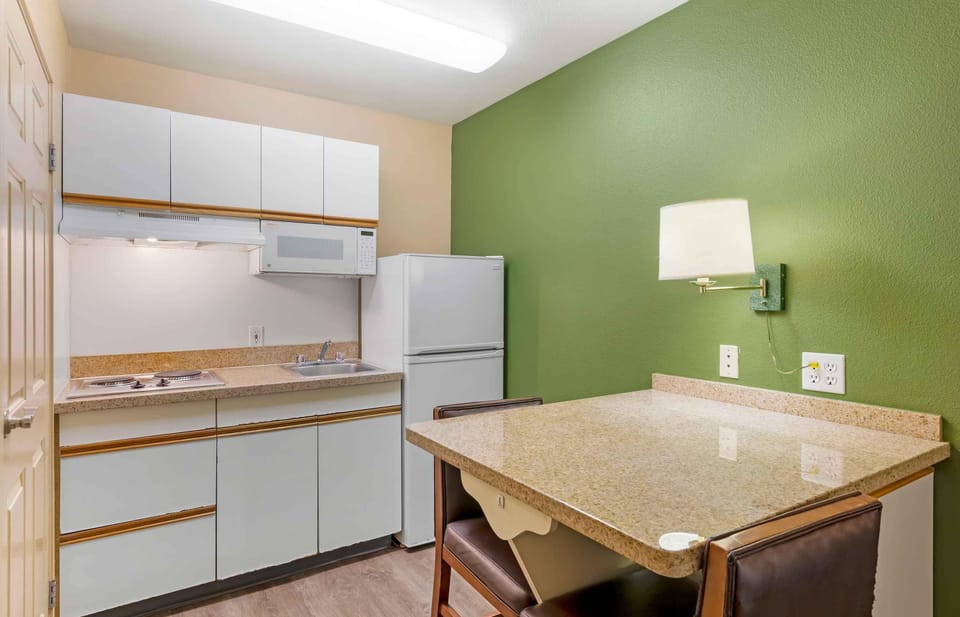 Fridge, microwave, stovetop, coffee/tea maker
