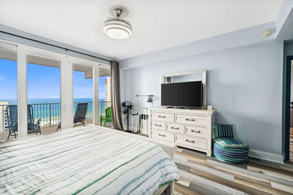 Primary Bedroom with Ocean Views, King Size Bed, Flat Screen TV, Ensuite Bathroom and Private Balcony Access