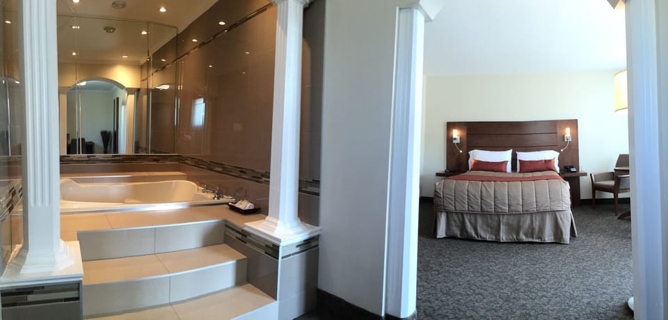 Superior Suite, 1 Queen Bed, Jetted Tub | Hypo-allergenic bedding, desk, laptop workspace, blackout drapes