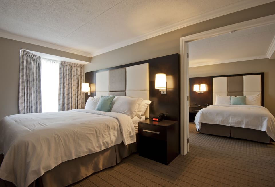 Family Suite, 2 Bedrooms, Kitchenette | Hypo-allergenic bedding, pillowtop beds, in-room safe, blackout drapes