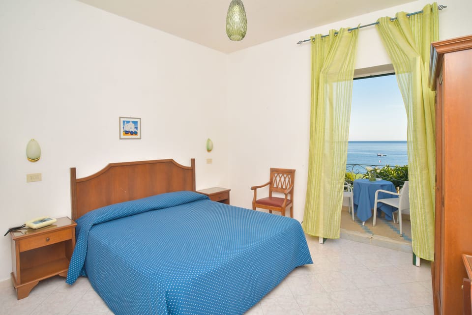 Standard Room, Partial Sea View | In-room safe, individually furnished, desk, cribs/infant beds