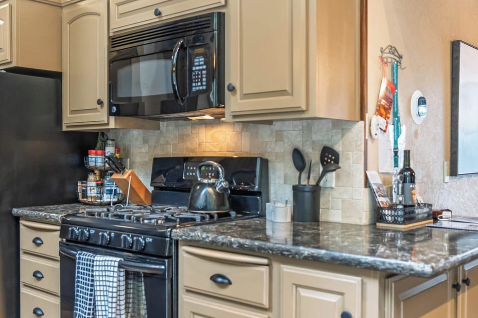 Cabin kitchen magic: vintage charm meets modern convenience.