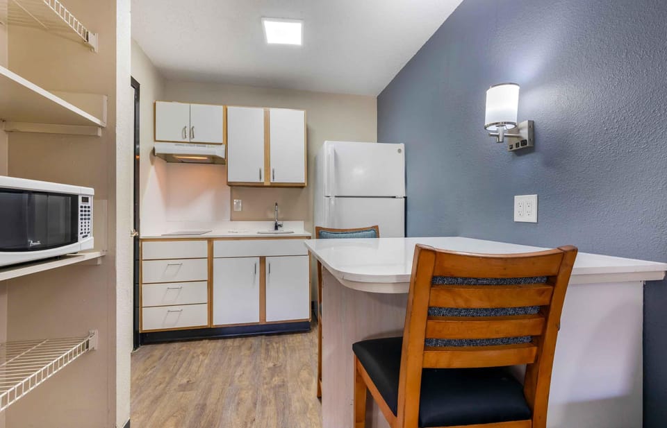 Deluxe Studio, 1 Queen Bed with Sofa bed, Non Smoking | Private kitchen | Full-size fridge, microwave, stovetop, coffee/tea maker
