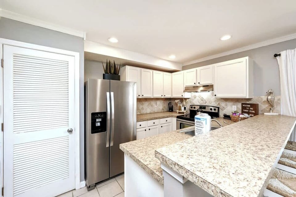 Our kitchen is fully stocked with dishes, silverware, utensils, cookware, bakeware, and a variety of small appliances.