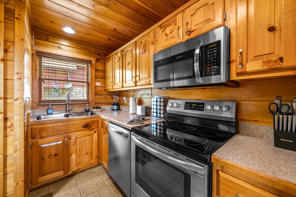 Fully stocked kitchen with stainless appliances