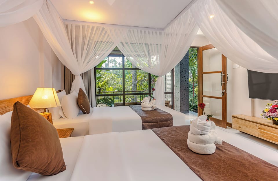 Family Bungalow, 2 Bedrooms, Garden View, Garden Area | Minibar, in-room safe, individually decorated, desk
