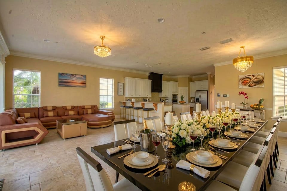 open concept living room connecting to kitchen and formal dining area