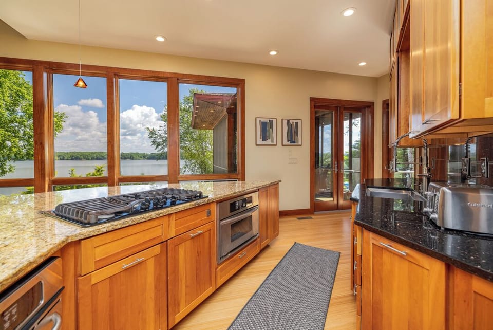 Kitchen with gas range, oven and microwave
