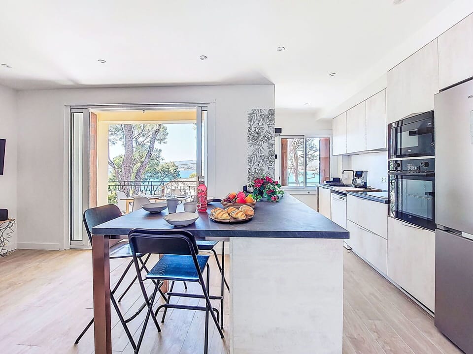 Furniture, Interior Design, Flooring, Kitchen, Countertop, Floor, Wood, Chair, Wood Flooring, Kitchen & Dining Room Table