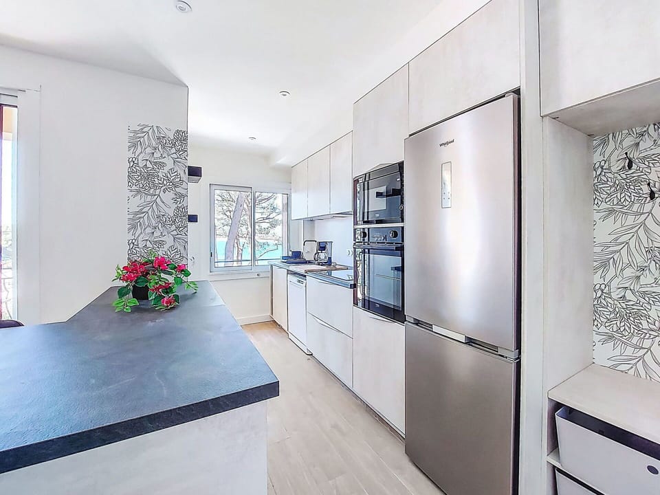 Kitchen, Flooring, Countertop, Interior Design, Kitchen Appliance, Floor, Major Appliance, Wood, Furniture, Cabinetry