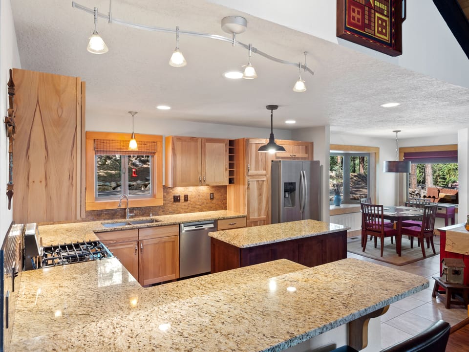 Kitchen with island and fully stocked with the essentials to make meals easy