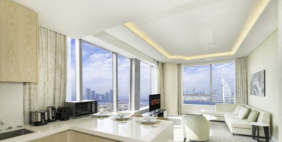 Deluxe Apartment | Living area | 55-inch Smart TV with cable channels, TV, Netflix