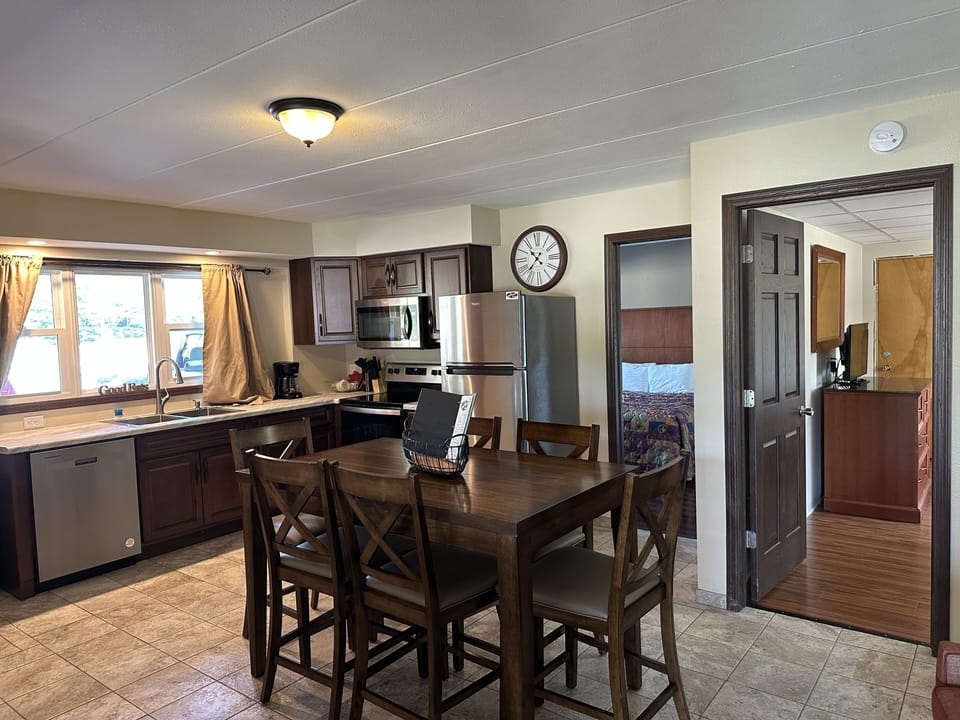 Family Suite, 2 Bedrooms | Private kitchen | Full-size fridge, microwave, coffee/tea maker, freezer