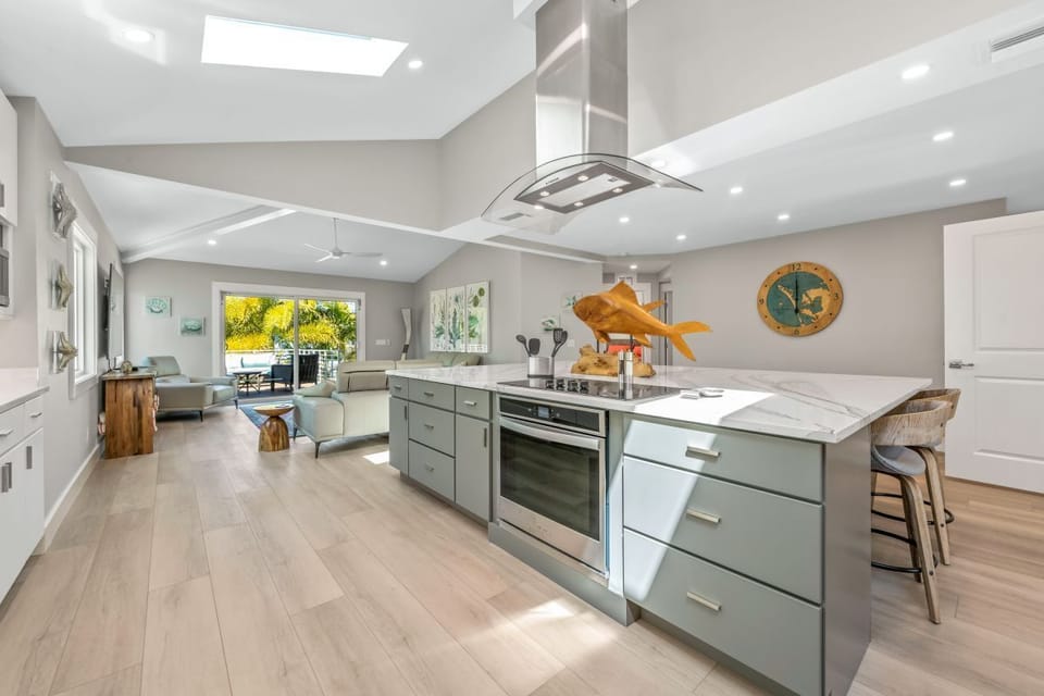 Large kitchen island nestled in the heart of the home is perfect for meals or entertaining