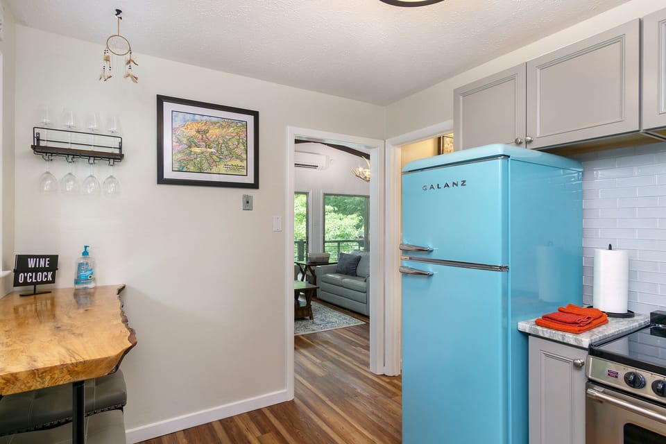 Vintage-style appliances with breakfast bar with seating for 2.