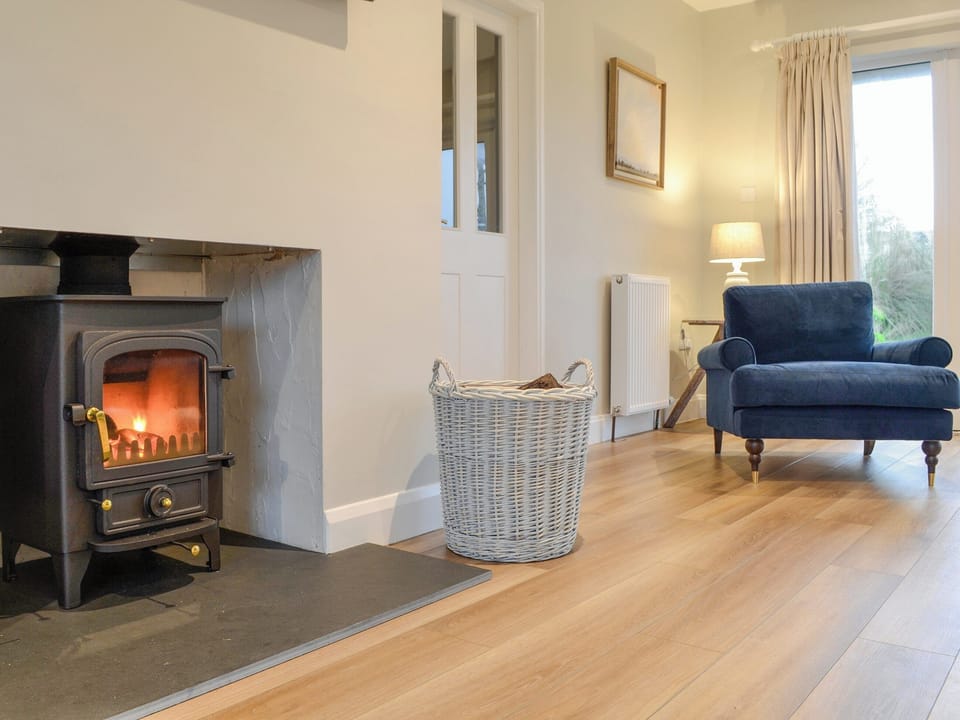Wood burner within living area | Culbae Cottage, Newton Stewart