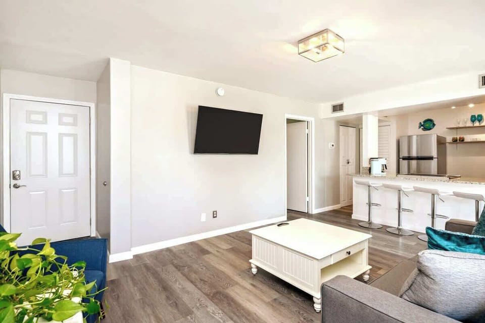 Enjoy the large Smart TV and comfy seating in the living room.