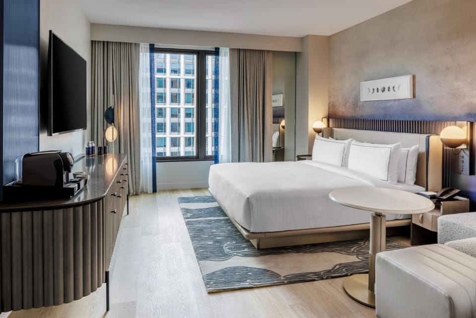 Premium bedding, down comforters, in-room safe, desk