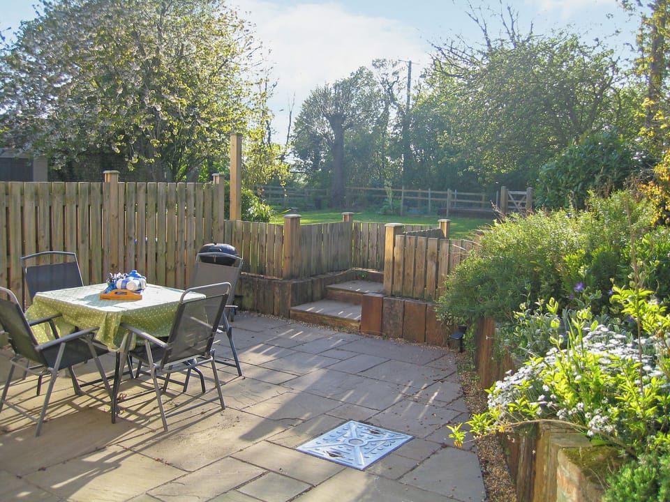 Inviting patio | Wallages Cottage - White House Farm Holiday Cottages, Knapton, near North Walsham