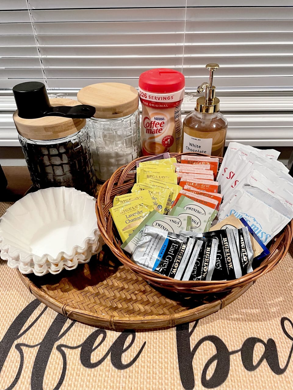 Selection of teas, hot chocolate, coffee, Nespresso pods,sugar, & flavored syrup