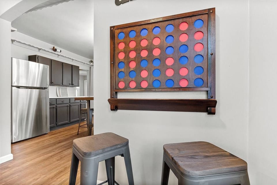 Everyone loves Connect Four - especially the giant, wall mounted version.  Grab a couple stools from the kitchen to give little kids a boost.