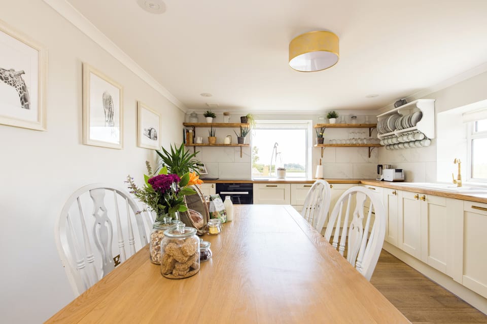 Kitchen table with seating for 8-10 guests