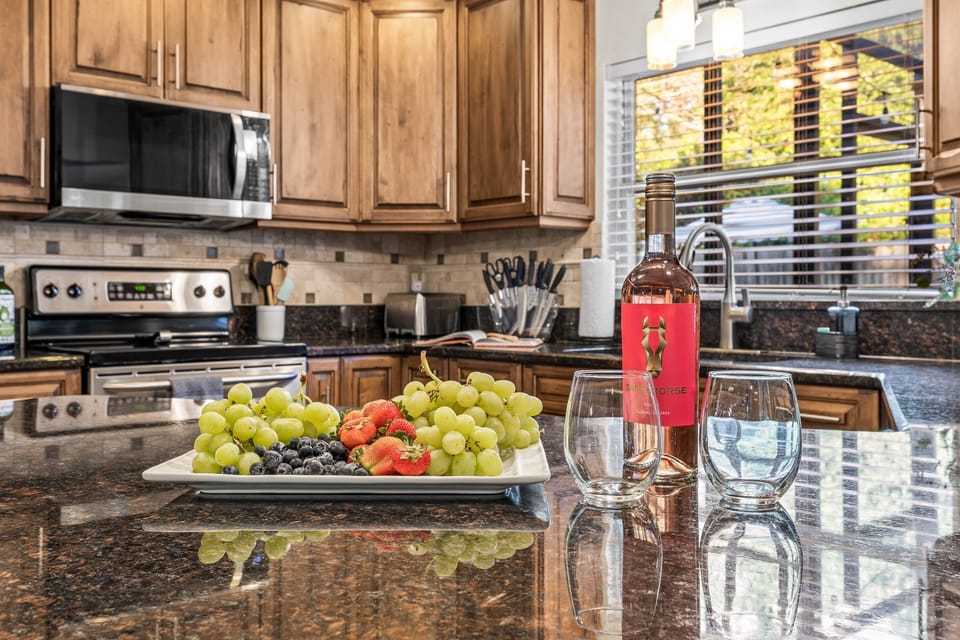 Enjoy cooking and dining in gourmet kitchen fully stocked with beautiful kitchen with stainless steel appliances and granite counter tops.  