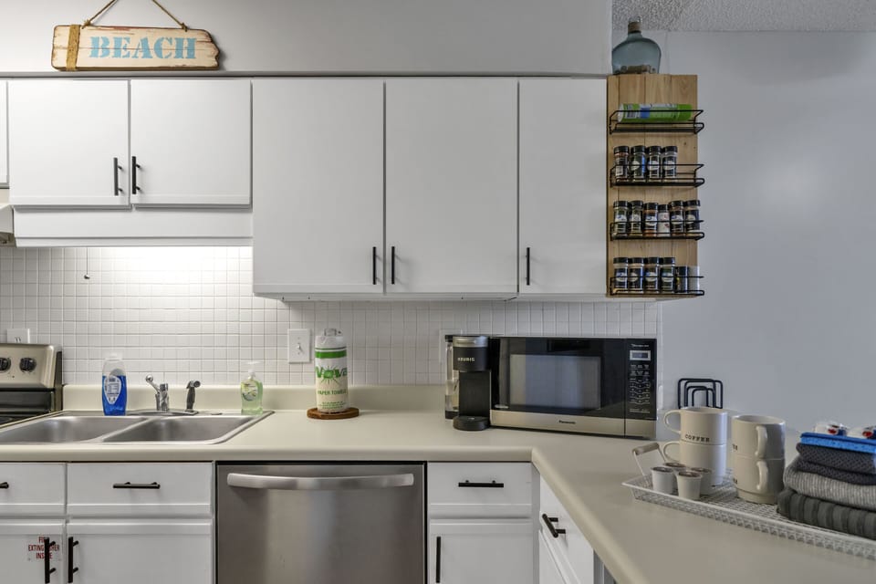 Cozy kitchen space.
**Spice rack has been removed.