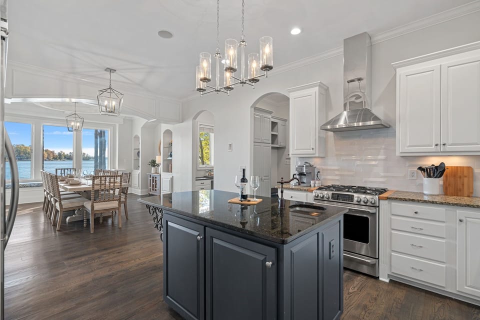 Gourmet kitchen with island and upgraded appliances.