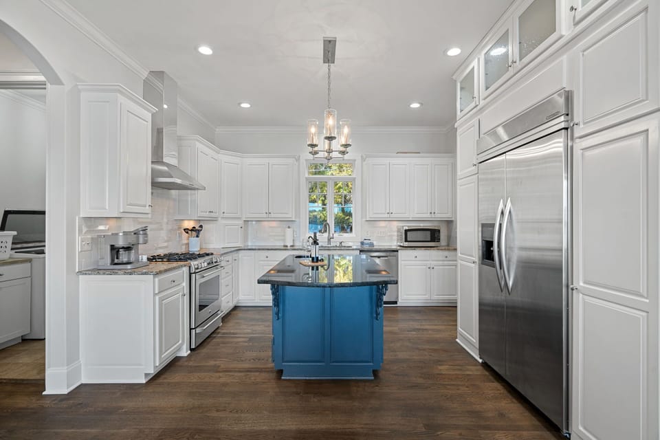 Gourmet kitchen with island and upgraded appliances.