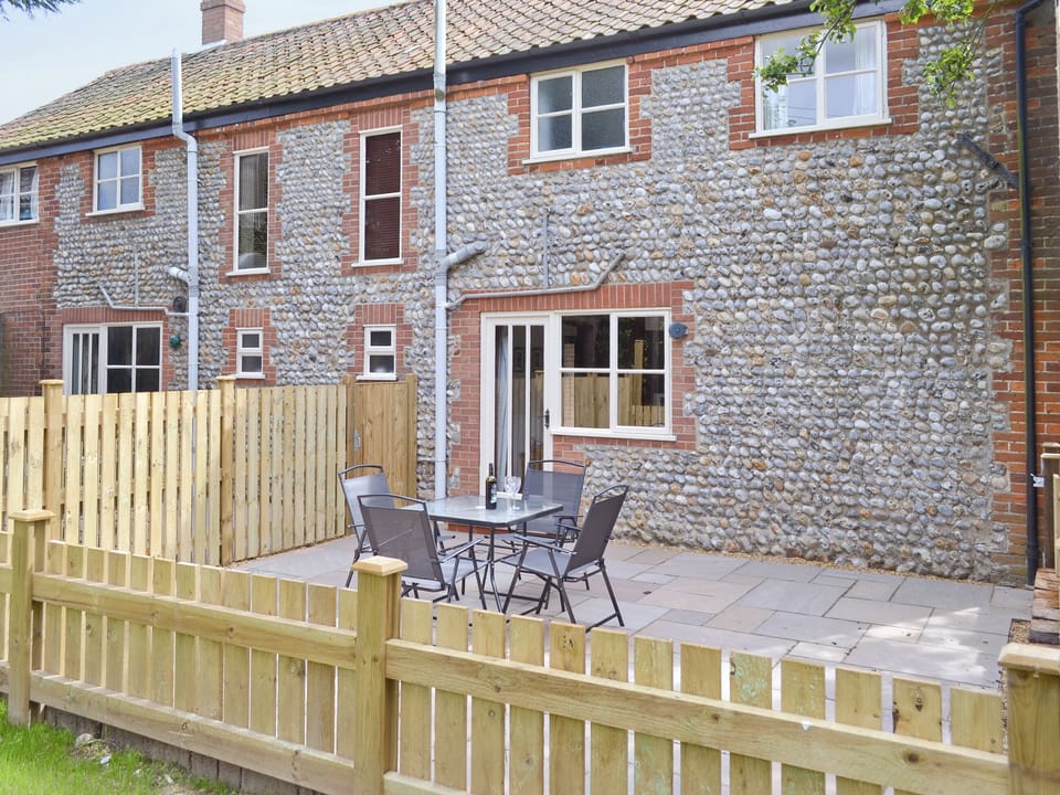 Enclosed patio to rear | The Granary - White House Farm Holiday Cottages, Knapton, near North Walsham