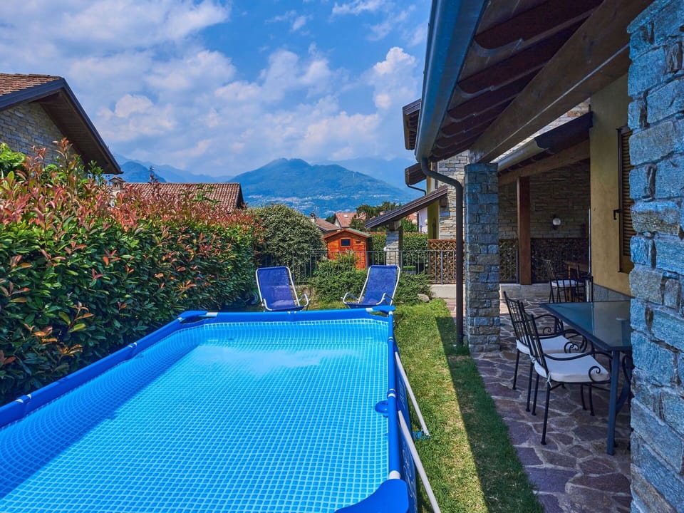 Sky, Plant, Water, Furniture, Cloud, Property, Building, Swimming Pool, Blue, Chair
