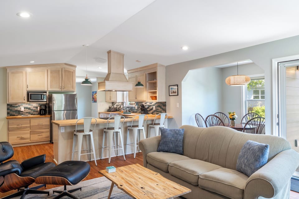 Open-concept kitchen and living area with SmartTV and a cozy indoor fireplace