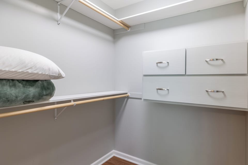 Primary bedroom walk-in closet