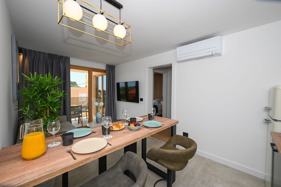 Grand Apartment, 1 Bedroom, Courtyard View | Living area | 40-inch LCD TV with cable channels, TV