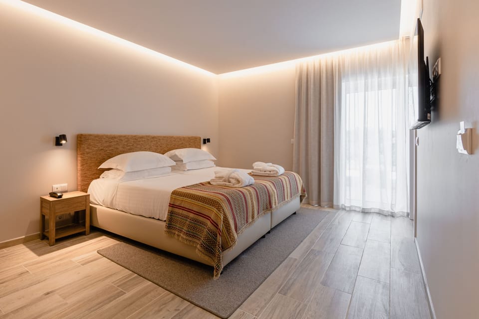 Superior Double or Twin Room, Patio | Minibar, in-room safe, individually decorated, blackout drapes