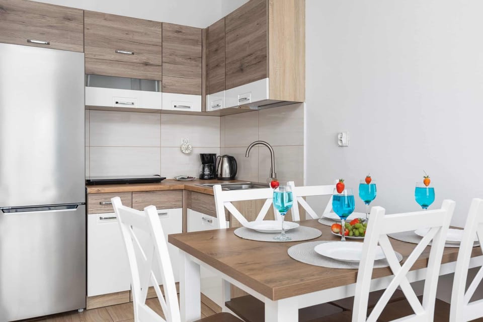 Large table with chairs for eating communal meals. 
