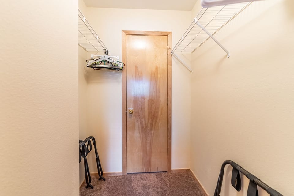 Primary bedroom walk-in closet.