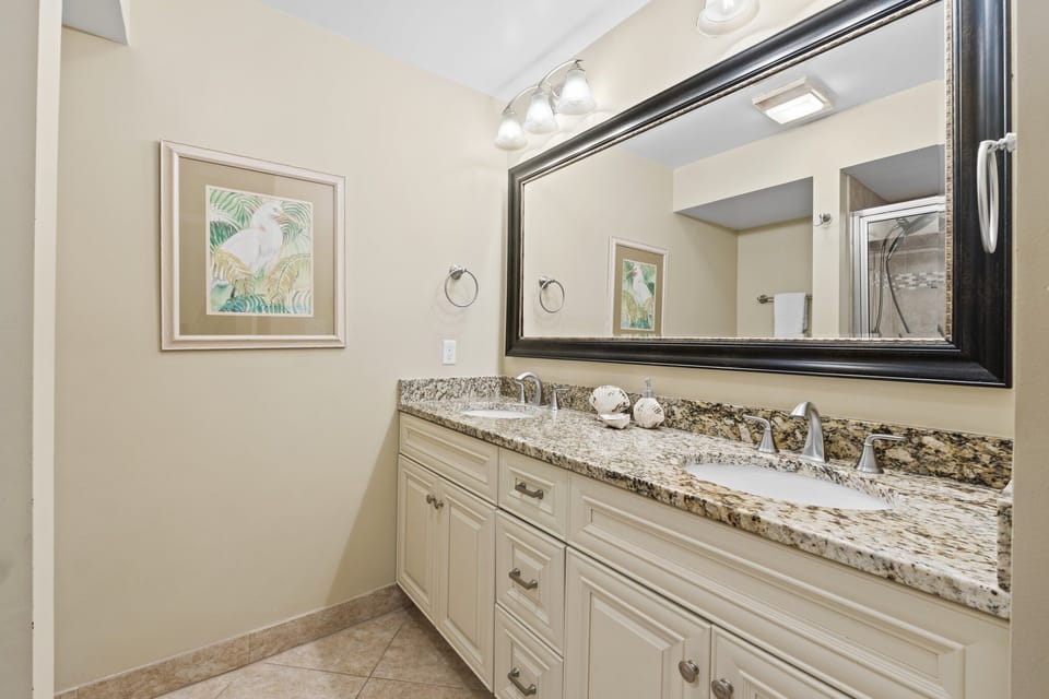 Master bath features granite counters with dual sinks and plenty of cabinet storage. Step in tiled shower. All amenities include bath linens, shampoo, conditioner, body wash and lotions.