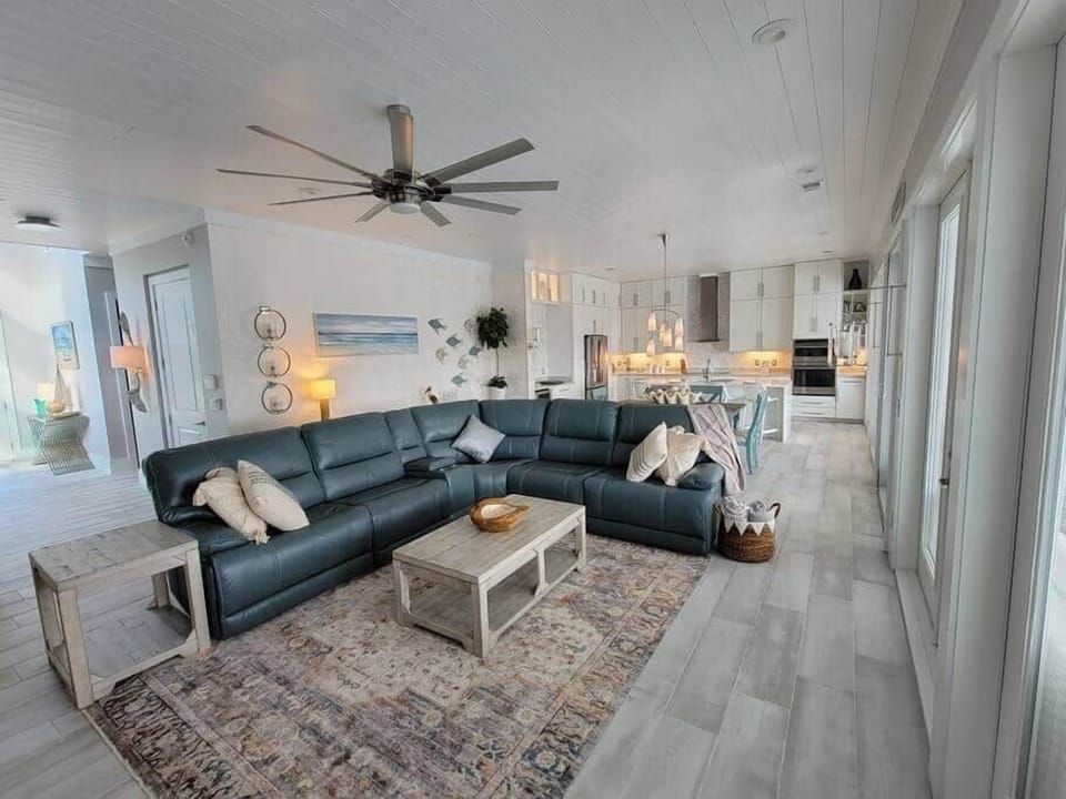 Large living area that views the outdoor pool/patio area. 