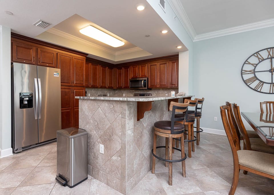 Gather around the stylish breakfast bar to share drinks and laughter while feeling the beach vibe all around you
