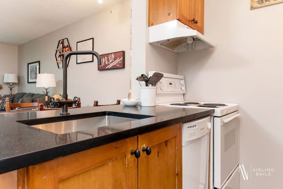 Full kitchen with a drip coffee machine, ground coffee, tea and sugar.