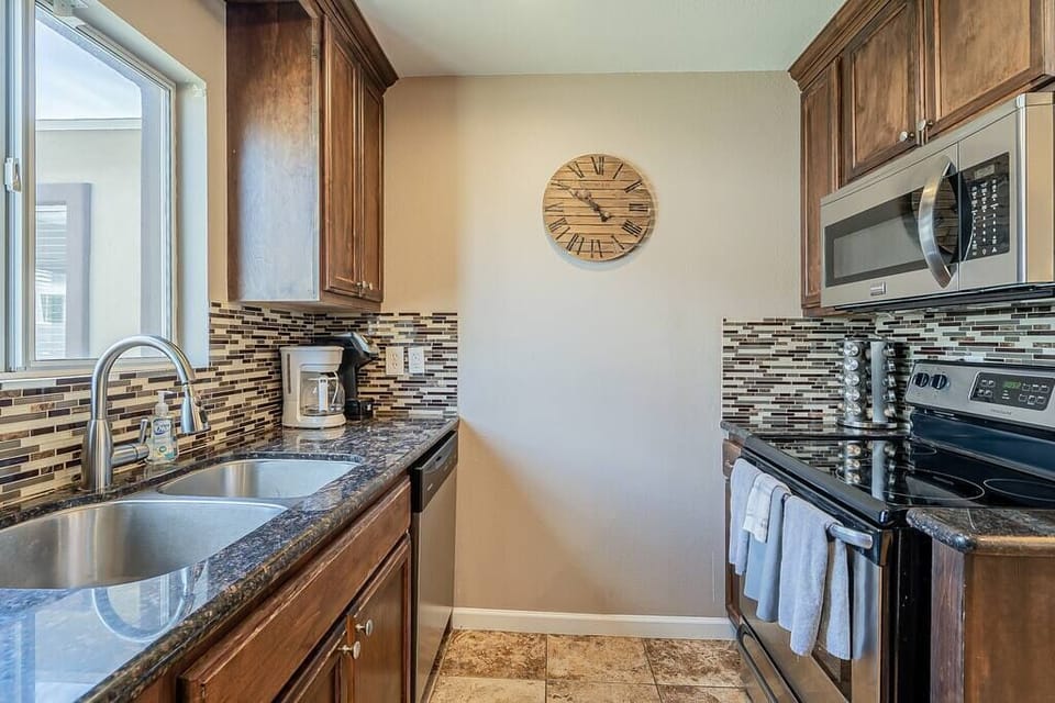 Our cozy kitchen is fully stocked with all your cooking needs , from spices to pots and pans.  Take a sip of your morning joe while gazing out the window while being warmed by the beautiful Arizona sun!