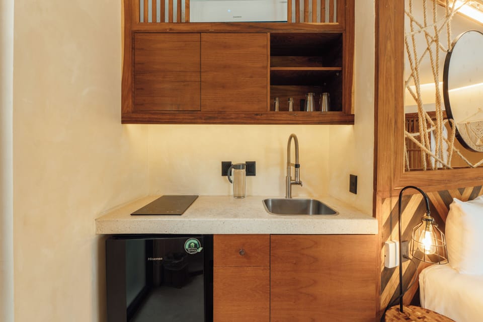 Mini-fridge, stovetop, cookware/dishes/utensils