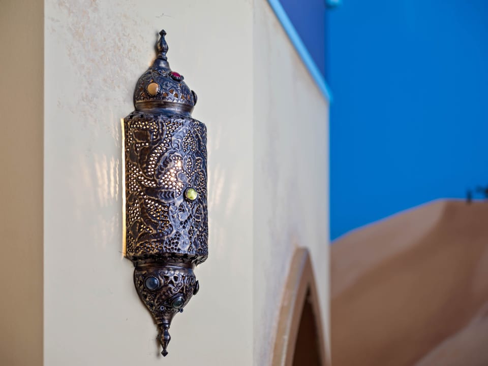 - Intricate Moroccan style lantern glows inside the Aladdin room  
- Detailed design adds warmth and a magical fairytale touch  
- Orlando vacation home with themed décor and kids fantasy spaces