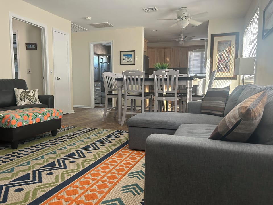 Living room angle from Changing Room.  Water views, luxe feel.  You will Love it
