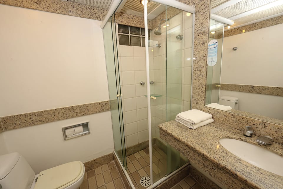 Deluxe Suite, Beachfront | Bathroom | Shower, rainfall showerhead, free toiletries, hair dryer