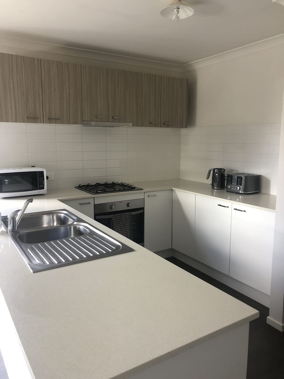  kitchen with stone bench tops